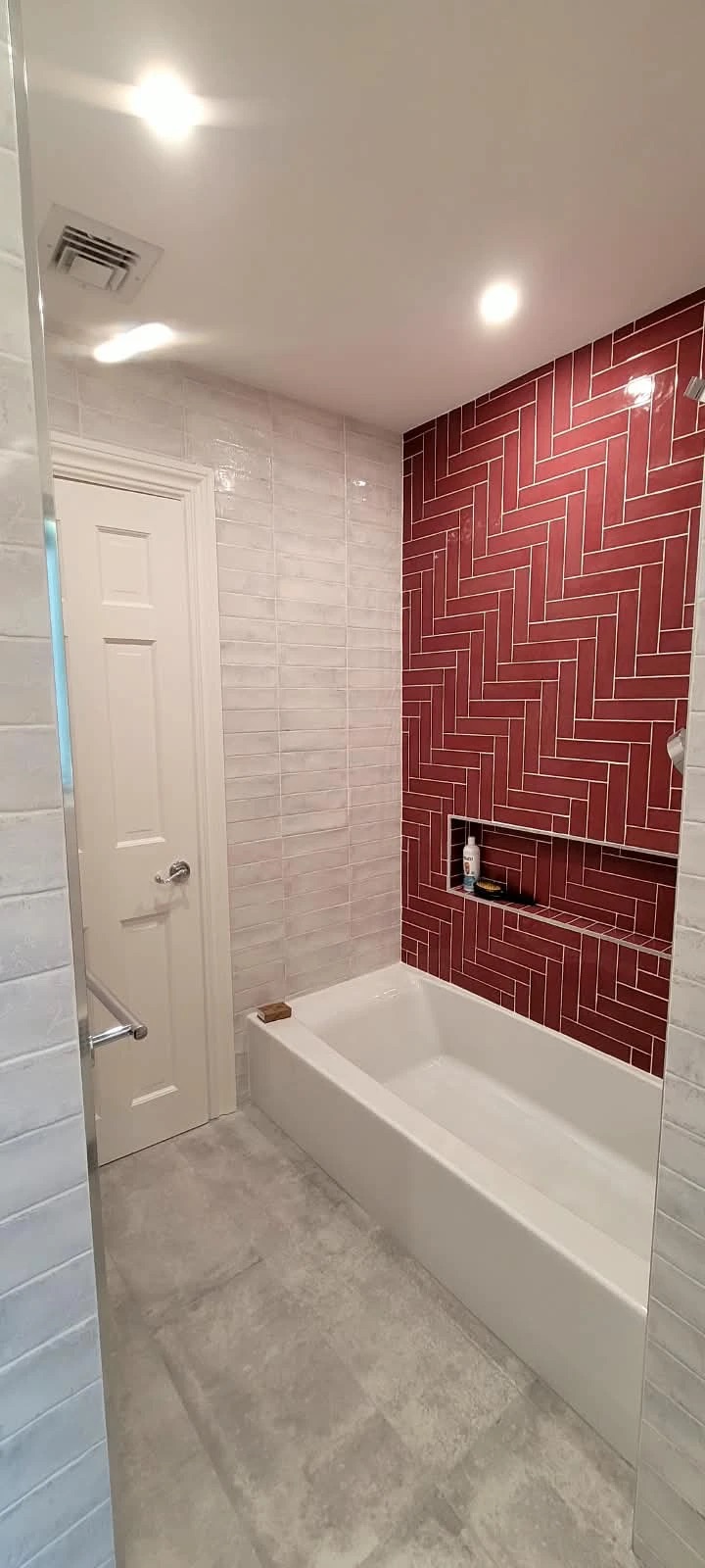 Herringbone tile bathroom, view 1