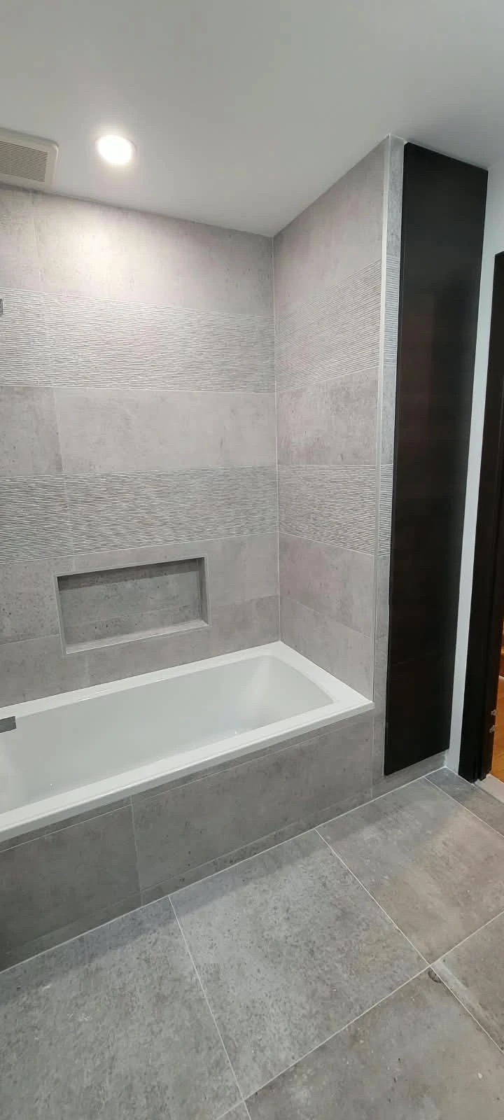 Grey tile bathroom, view 1