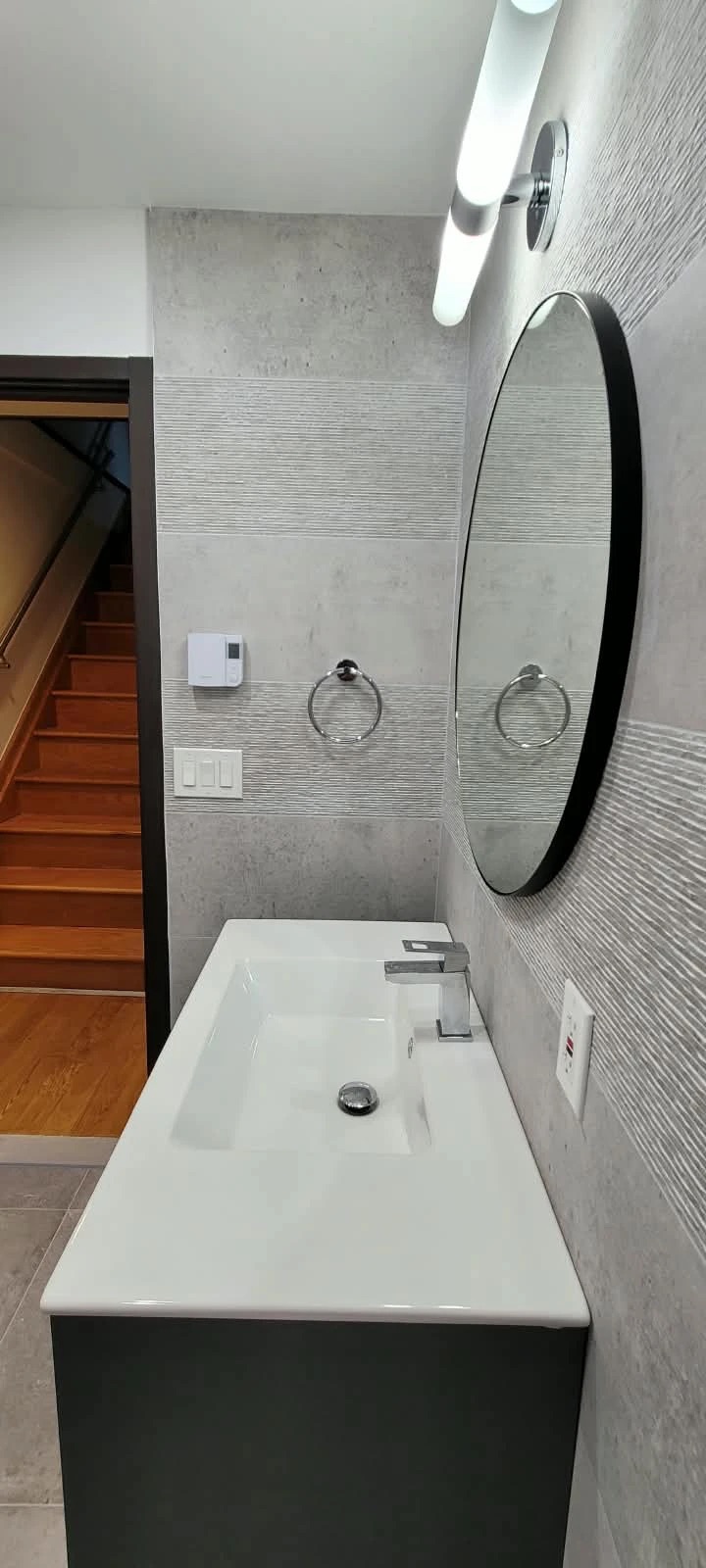 Grey tile bathroom vanity