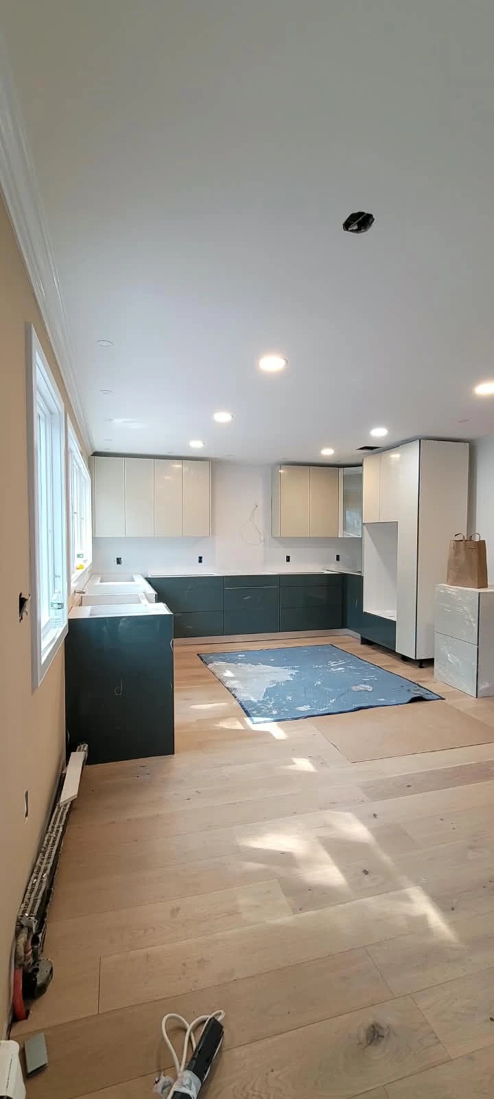 Kitchen mid-remodel with new cabinets fitted before counters go in
